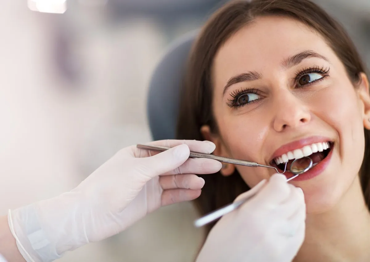 Dentist discussing smile makeover options with a patient during a cosmetic dentistry consultation.